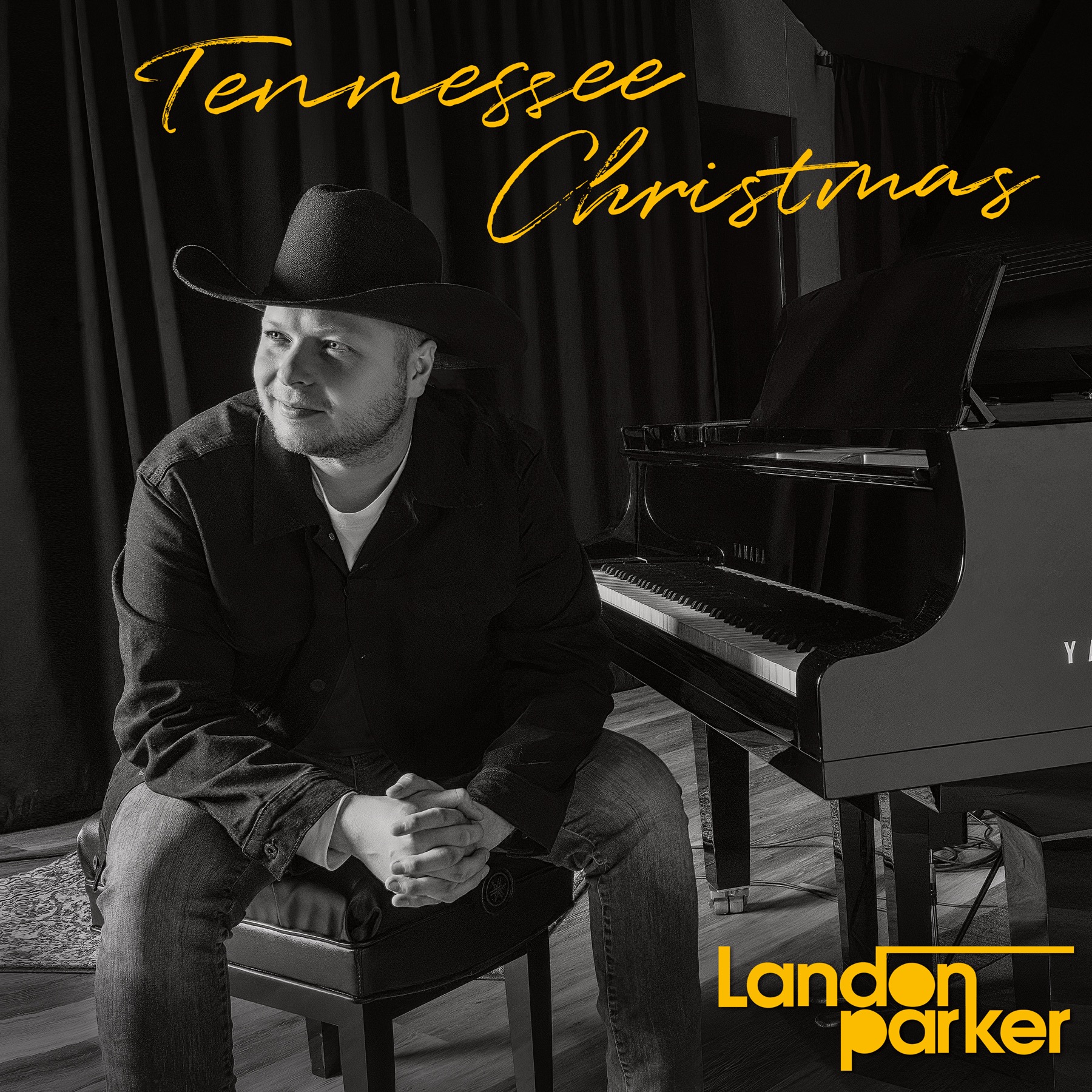 Tennessee Christmas Cover Art featuring Landon Parker sitting in the recording studio by a piano